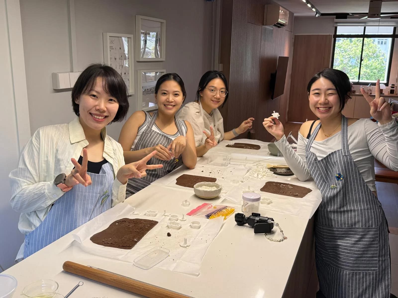 Students baking together at the worktable in the studio kitchen